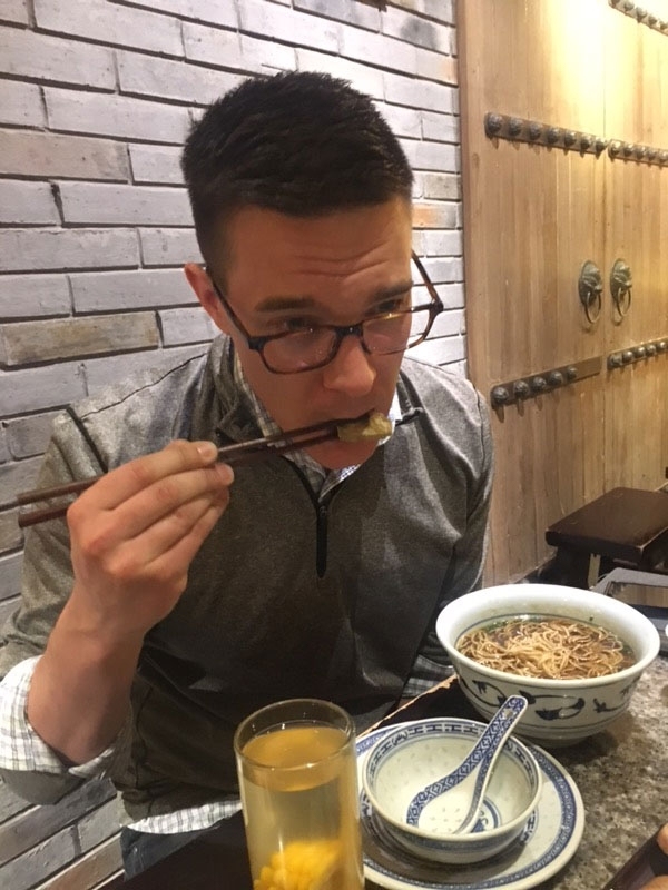 Joe eating stinky tofu